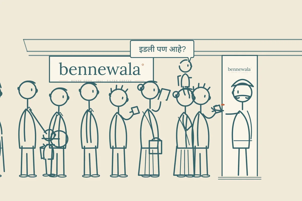 Launch film frame: the queue under the bennewala sign