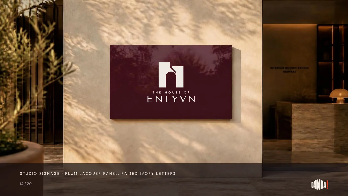 Studio signage: plum lacquer panel with raised ivory letters