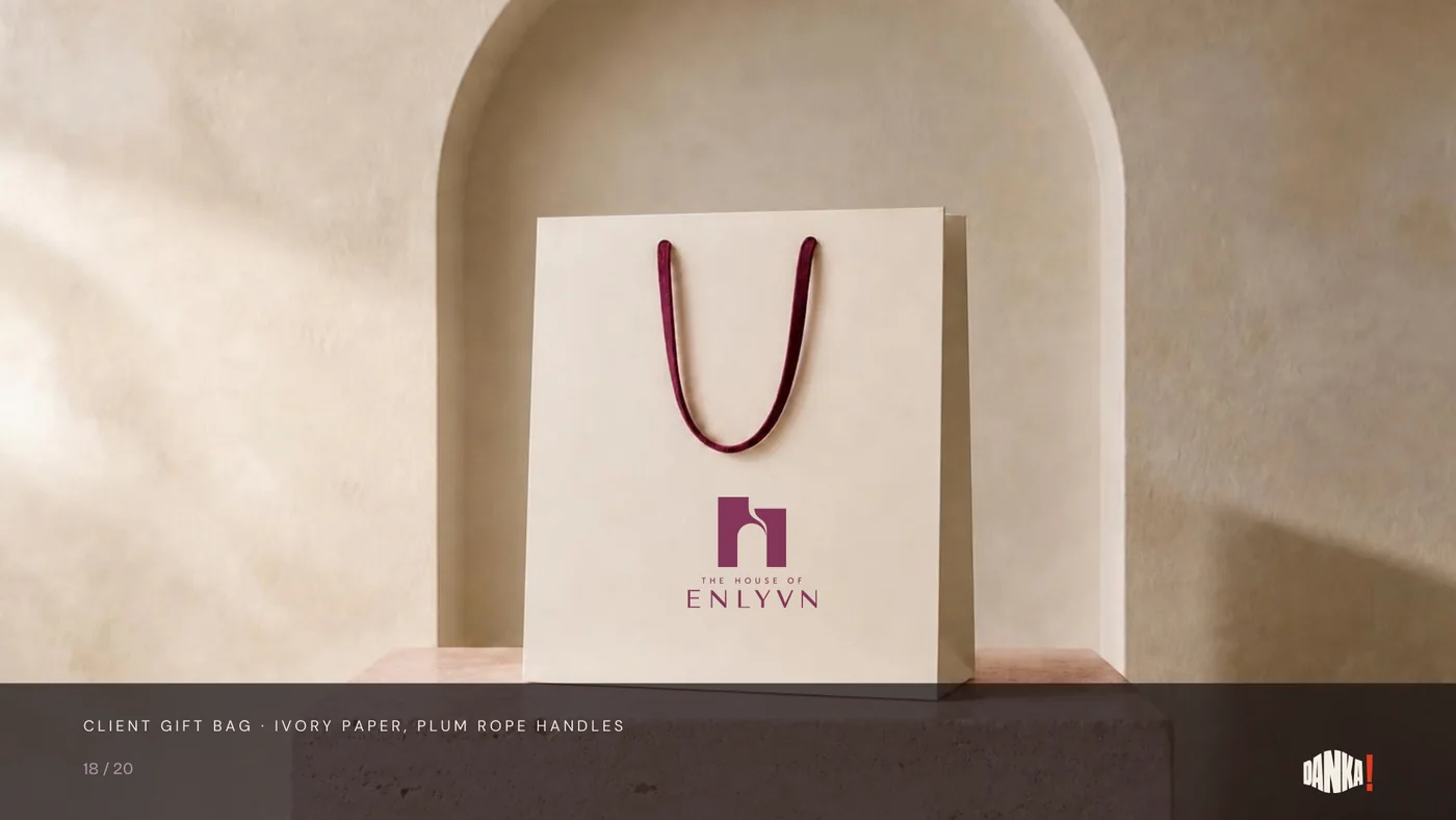 Client gift bag in ivory paper with plum rope handles