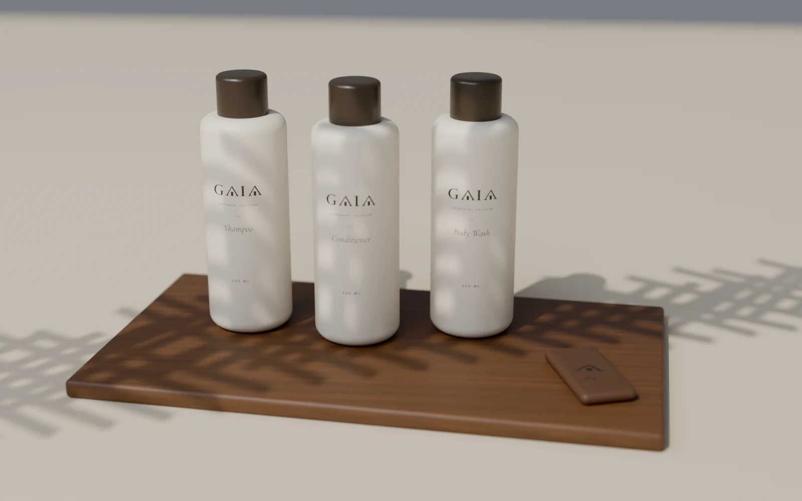 GAIA bath amenities and a room key tag on a teak tray under palm shade
